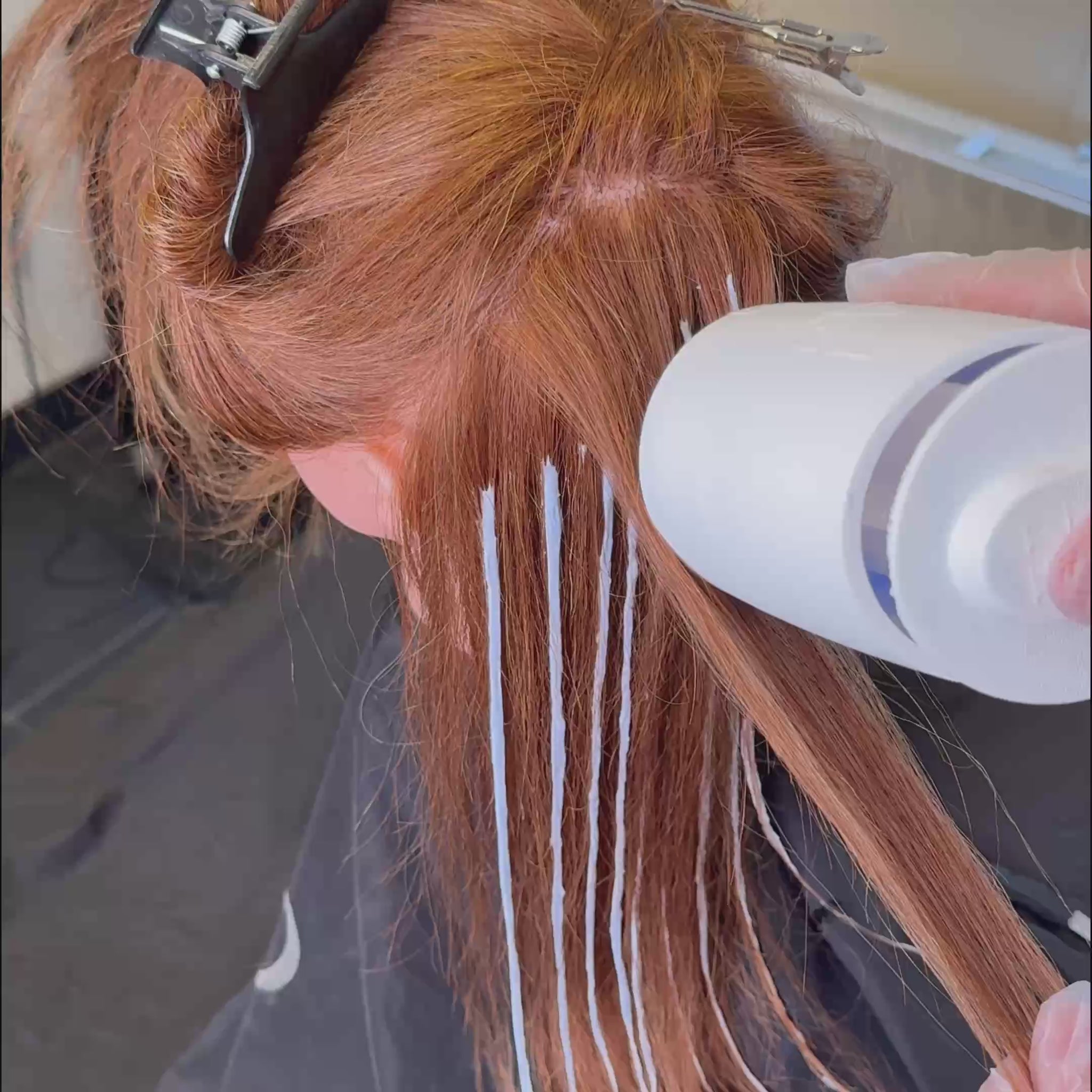 Velion Hair Highlight Gun applying lightener directly to sectioned hair
